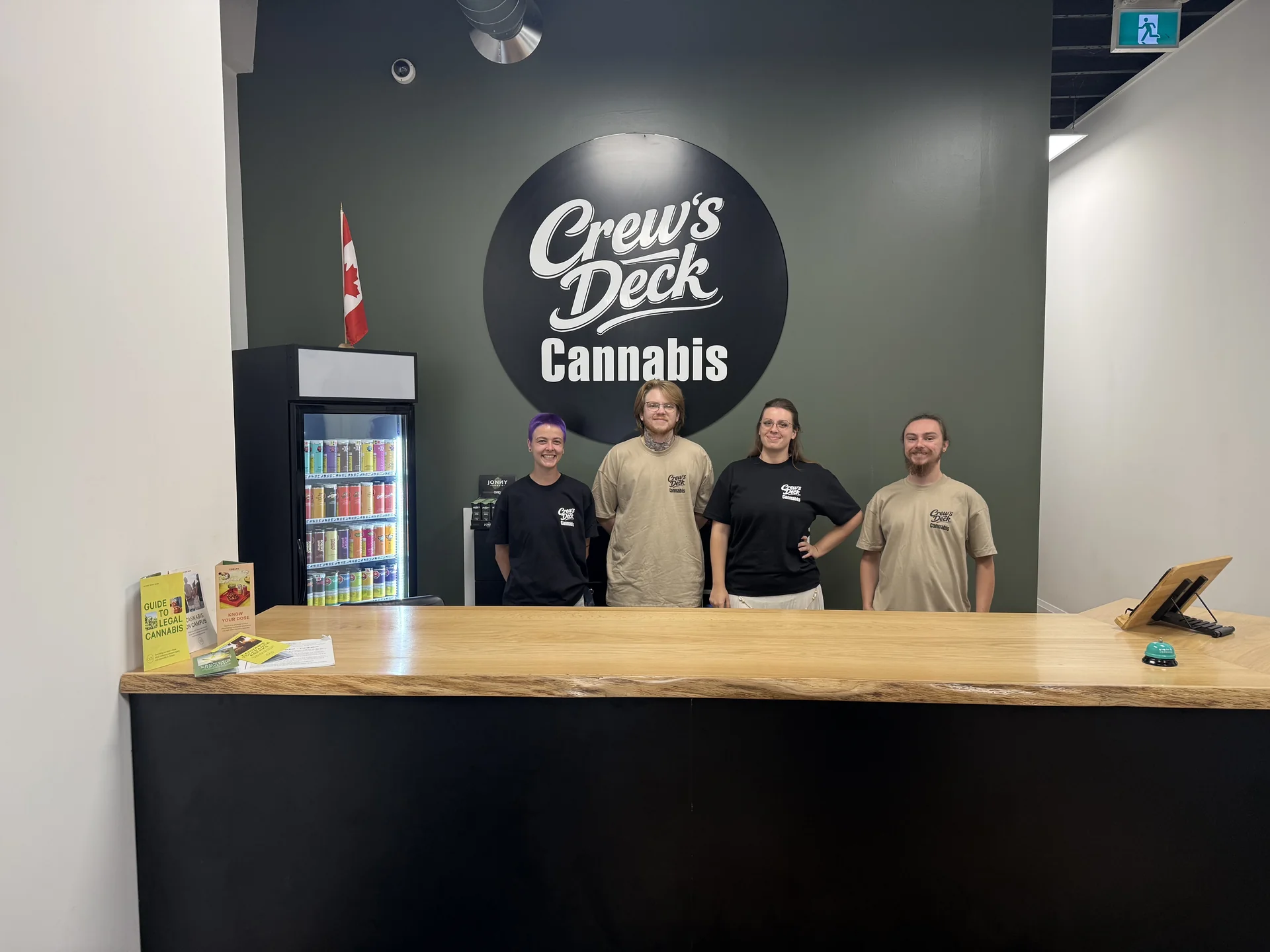 The Crew&rsquo;s Deck Cannabis team behind the counter